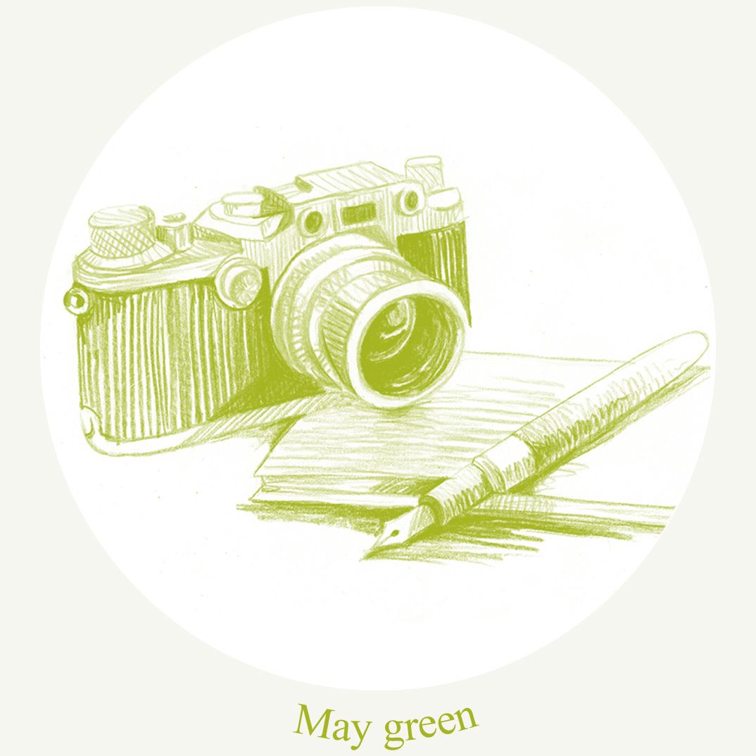 "may green" a camera and a notebook